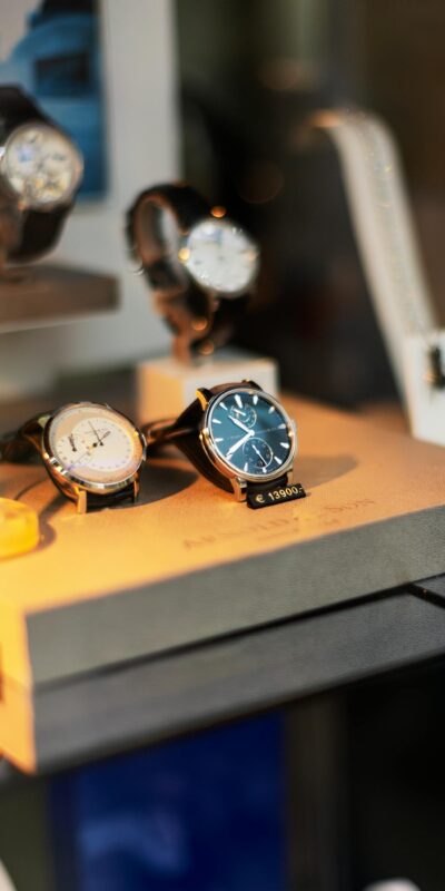 Luxurious wristwatches showcased in a shop window in Vienna, Austria.