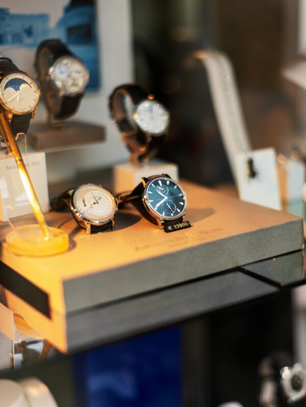 Luxurious wristwatches showcased in a shop window in Vienna, Austria.